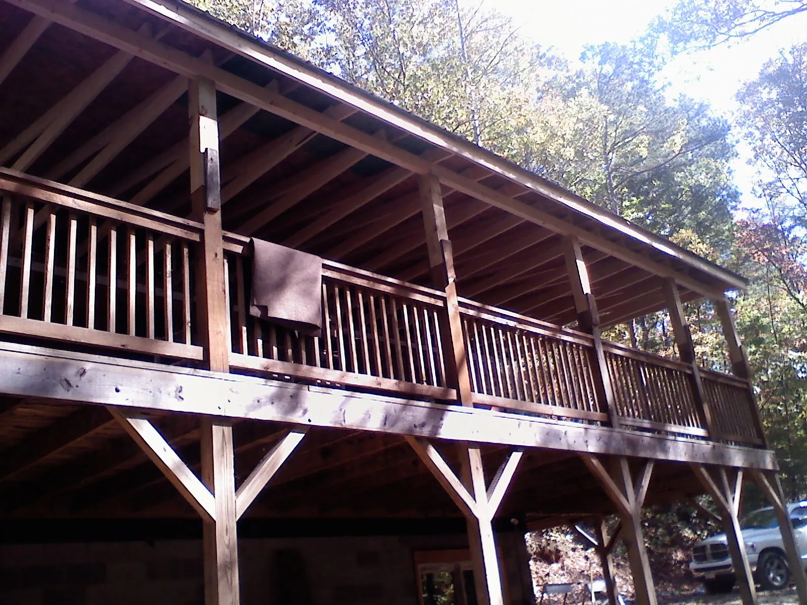 Timber framing under a new elevated porch and deck in Hayfork